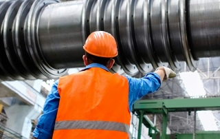 Industrial Worker Inspecting Heavy Machinery